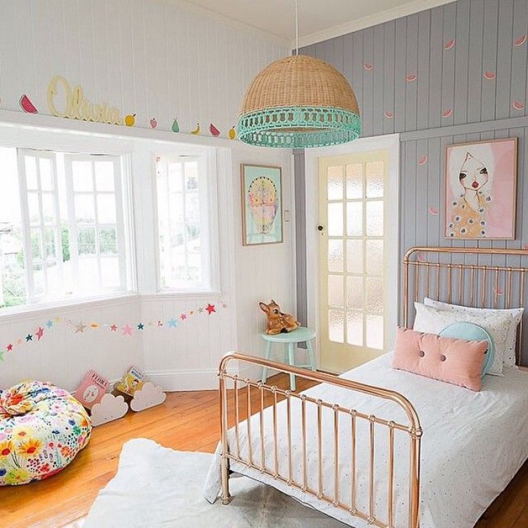 bright girls room with copper bed