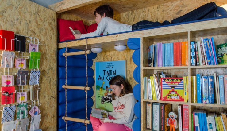 wardrobe hiding a reading nook for kids