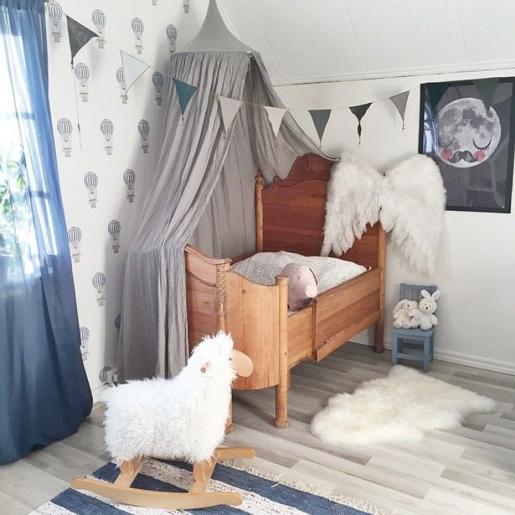 grey canopy and wings in a girls room