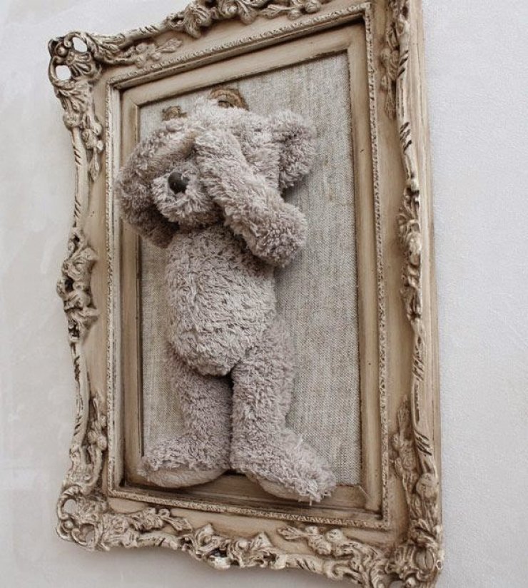 stuffed animal in a frame